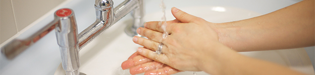 A hospital worker washing their hands