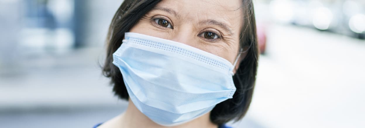 Photo of a woman wearing a medical mask
