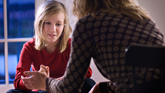 A young person talking to a counsellor.